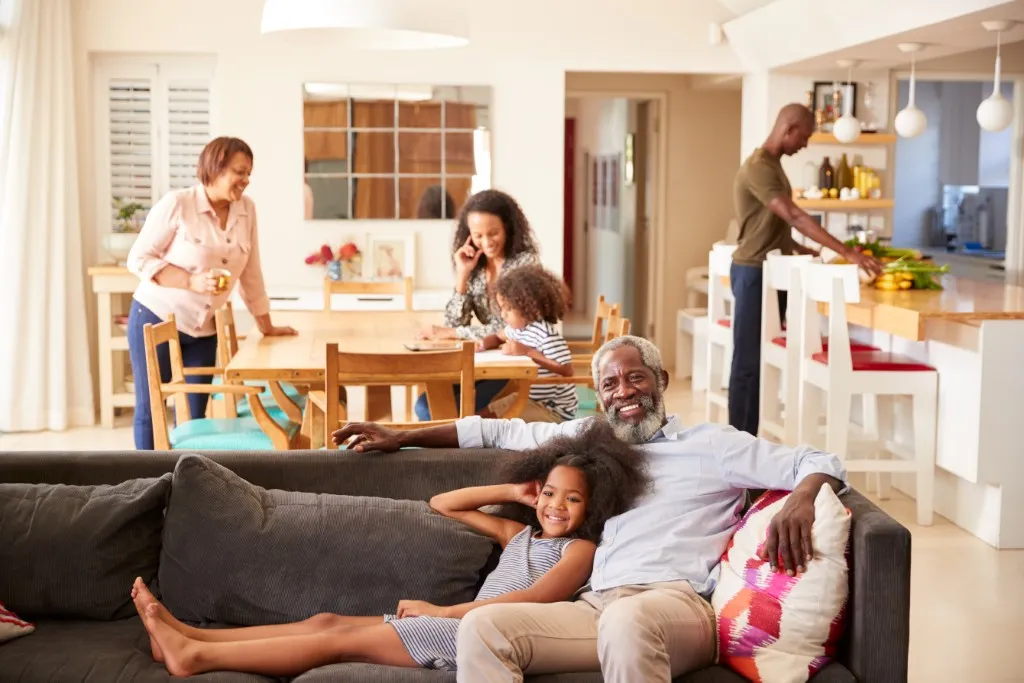A multi-generational family spending time together in a modern Central Developments lounge.